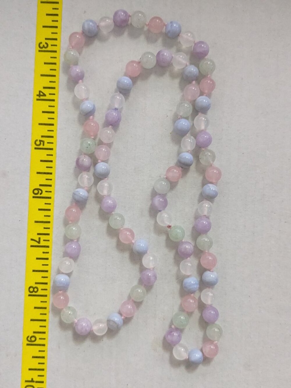 Pastel Colored Quartz Round Stone Individual Knotted Continuous Necklace.
